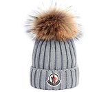 The elongated shape of the dome, elegant decorative knitting, this fashion accessory suitable for almost any type of outerwear. Moncler women's hat with a pompom, knitted 100% wool, tightly covering the ears Size: One size fits all Suitable not only for sports style. Looks great with a coat and a fur coat.