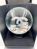 CHANEL VIP CHRISTMAS GIFT SNOW GLOBE, WHICH IS CONSIDERED AS THE MOST BEAUTIFUL SNOW GLOBE CHANEL EVER OFFERED.  THERE'S A NO. 5 MINIATURE CHANEL PERFUME IN THE GLOBE ALONG WITH SIGNATURE WHITE BAGS, AND GORGEOUS CAMELLIAS ON THE BOTTOM.  ITEM IS IN NEW CONDITION INCLUDING ORIGINAL BOX, A COATING UNDER GLOBE IS STILL INTACT  WOULD BE A GREAT ADDITION FOR YOUR OWN COLLECTION OR A WONDERFUL GIFT FOR SOMEONE YOU CARE. 