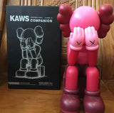 kaws passing through open edition model made from vinyl