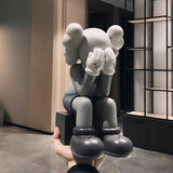 New Passing Through KAWS Open Edition Vinyl Figure in 4 different colours with original box KAWS' Passing Through Statues have been displayed all over the world, including galleries in Hong Kong, Fort Worth, and Philadelphia. Cop one of these today to bring the world-famous companion to your living room.